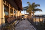 Deck off of the living and dining area with ocean views and gas BBQ grill